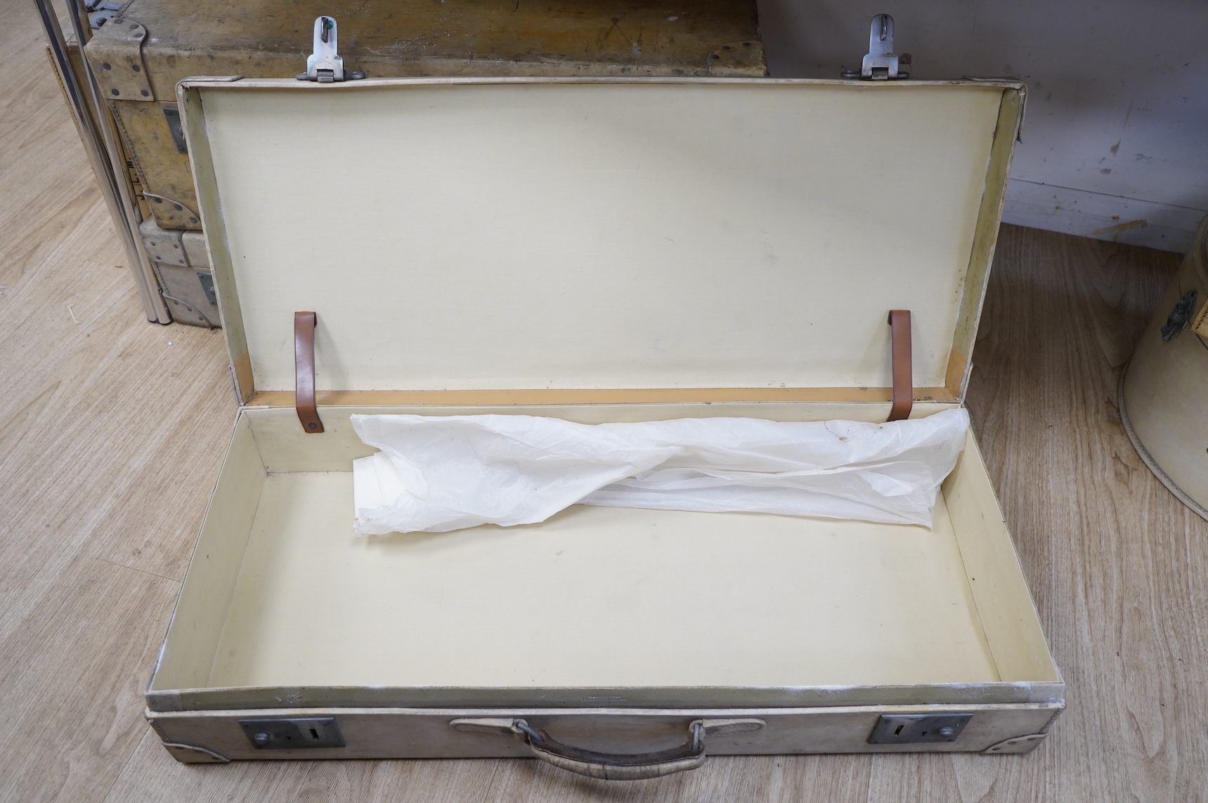 A collection of luggage comprising four vintage trunks and a hat box